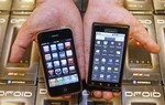 OREM, UT - NOVEMBER 5: A manager holds an App... OREM, UT - NOVEMBER 5: A manager holds an App...